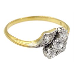 Early 20th century gold three stone old cut diamond crossover ring with diamond set shoulders, stamped 18ct Pt