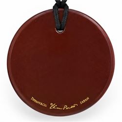 Tiffany & Co. red lacquer on Japanese hardwood round pendant necklace, on black silk cord by Elsa Peretti, signed 