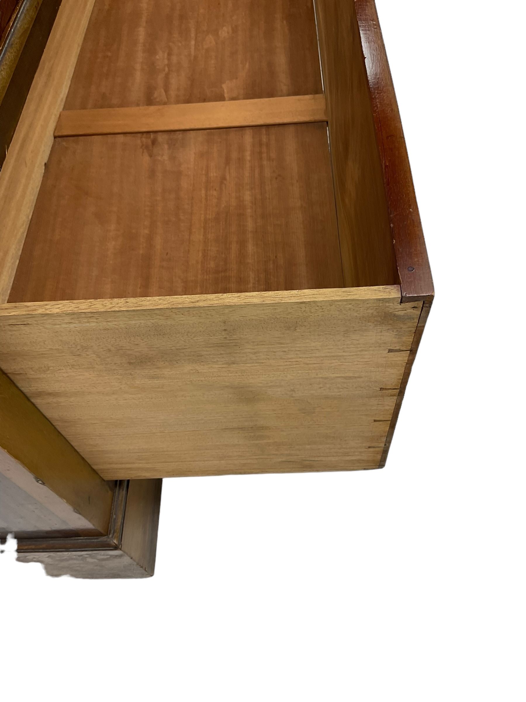 Edwardian inlaid mahogany wardrobe, projecting moulded cornice over central bevelled mirror glazed door, panelled uprights inlaid with trailing bellflowers and foliate decoration, the skirted base fitted with single drawer 