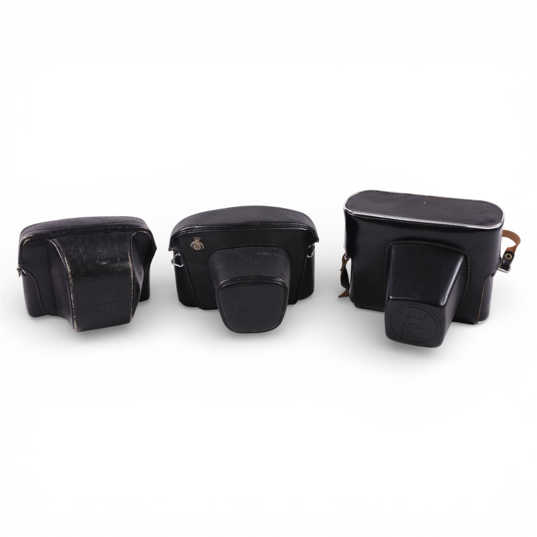 Asahi Pentax Spotmatic 35mm SLR camera, with Super-Takumar 1:1.8/55 lens, Petri Racer rangefinder camera and a Zenit-E camera, all in leather cases