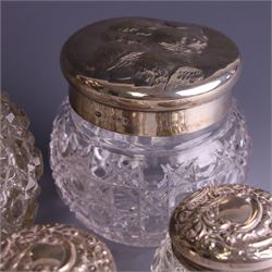 Early 20th century silver mounted cut glass scent bottle, with silver lid and three cut glass dressing table jars with silver lids, all hallmarked 
