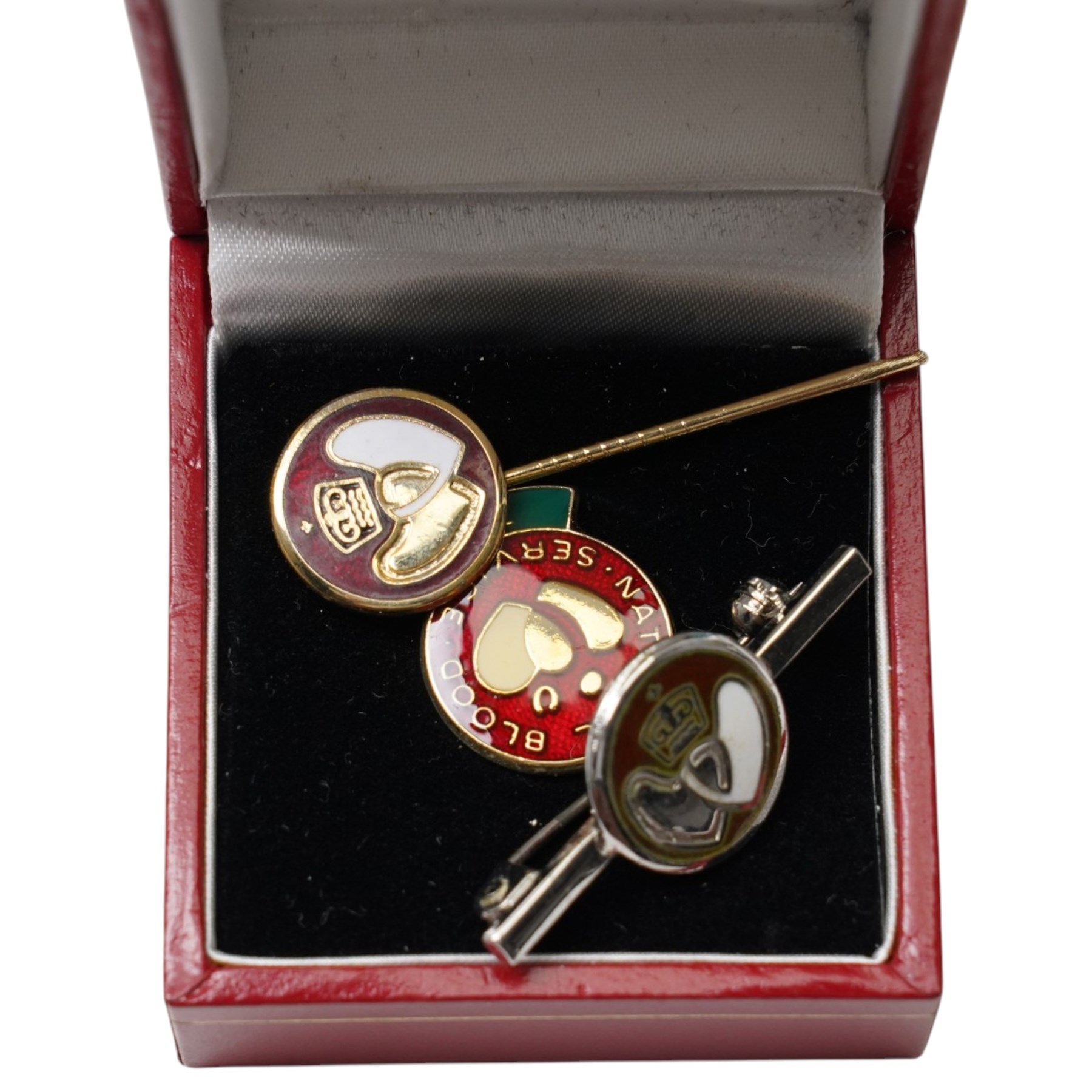 Two silver hinged bangles, 9ct gold mounted shell carved cameo brooch, badges, beaded necklaces etc