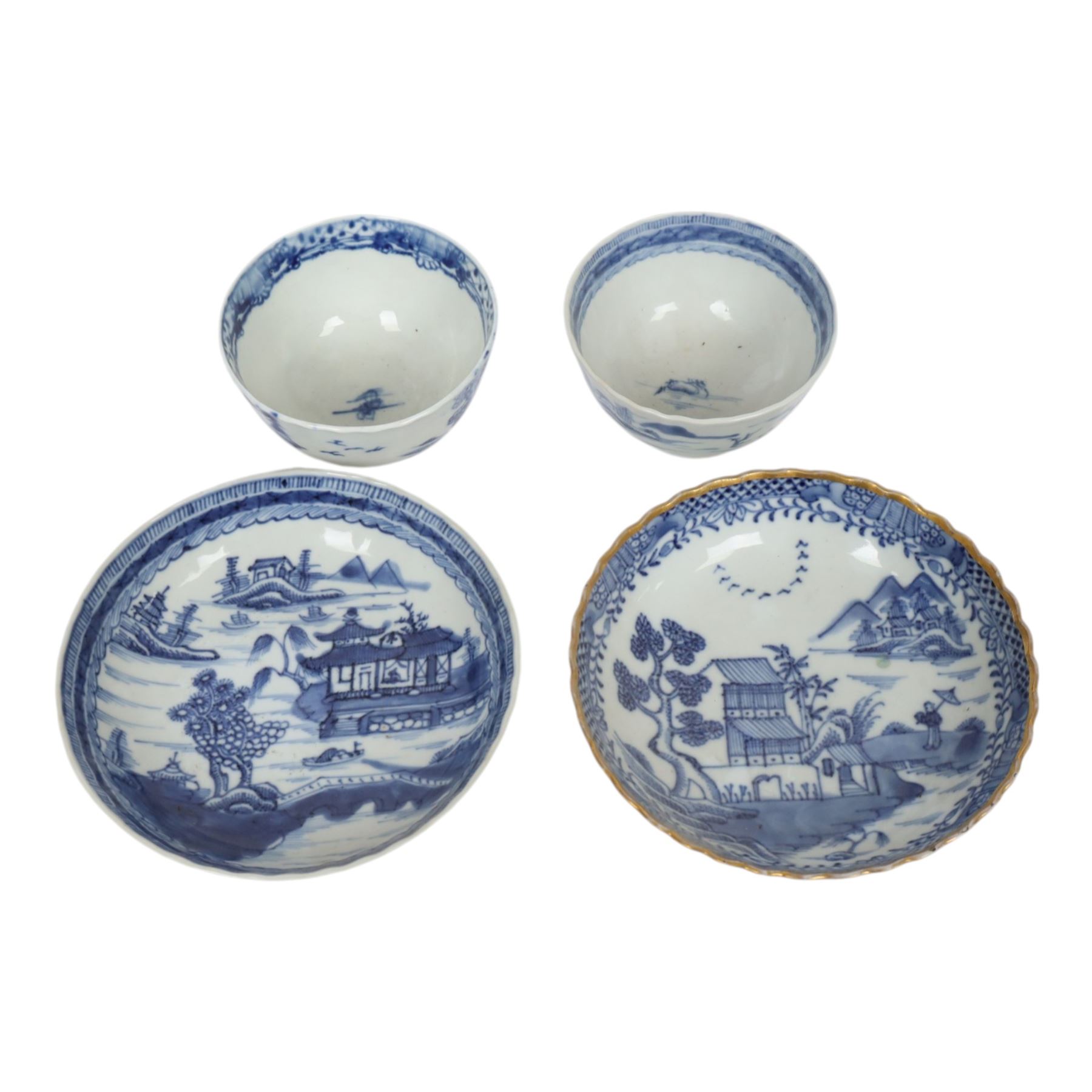 Two 19th century Chinese blue and white tea bowls, each decorated with traditional landscapes, together with two similar saucers, tea bowl H5cm, D9cm  