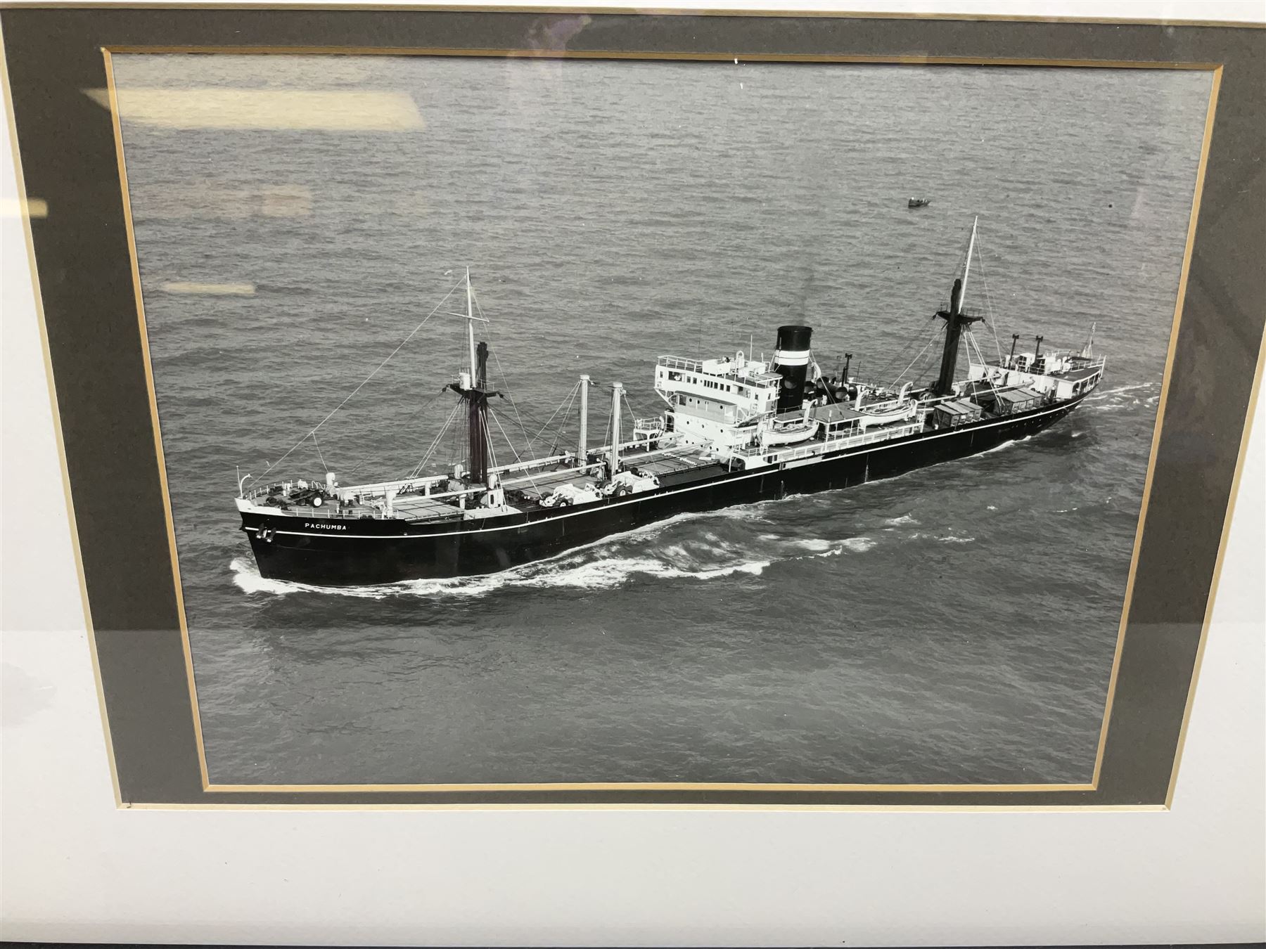 Set of twelve monochrome photographs of mid-20th century merchant vessels comprising general cargo ships, cargo liners, RMMV passenger cargo liners and hospital ship including Rowallan Castle, Drakensberg Castle, Stirling Castle, Capetown Castle, Pachumba, Tilapa etc; average size 18 x 24cm; uniformly mounted in black frames (12)
