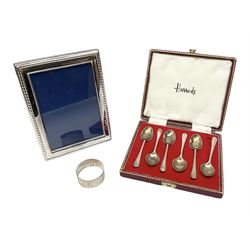 Set of six 1960's silver coffee spoons, hallmarked Sheffield, contained within a fitted case with interior inscribed Harrods, together with a silver napkin ring, hallmarked Birmingham, and a silver plated photograph frame, approximate silver weight 68.4 grams