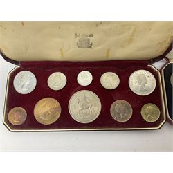 Four Queen Elizabeth II 1953 specimen coin sets, comprising farthing to crown coins, three in maroon Royal Mint dated cases the other in red dated case