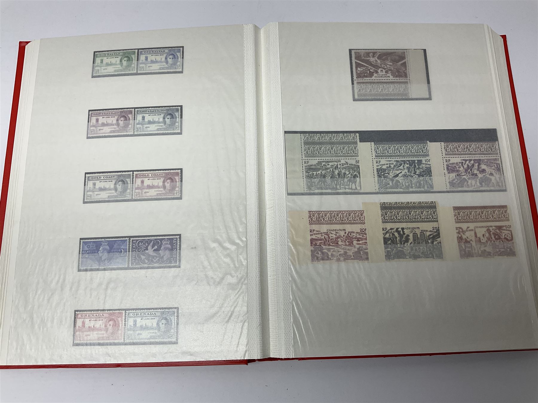 World stamps with many relating to Victory in Europe including King George VI '8th June 1946' stamps from various countries including Antigua, British Guiana, British Honduras, British Solomon Islands, Cayman Islands, Ceylon, Fiji, Grenada, Montserrat, St Helena etc, both mint and used stamps seen, housed in three stockbooks