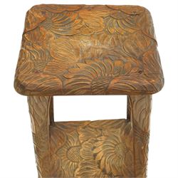Attrib. Liberty & Co. - Arts & Crafts carved Japanese pattern two-tier occasional table, the square top with rounded corners heavily carved foliate motifs, raised on tapering supports with scroll feet united by undertier