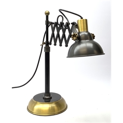 A black metal and brass adjustable scissor lamp, H50cm.