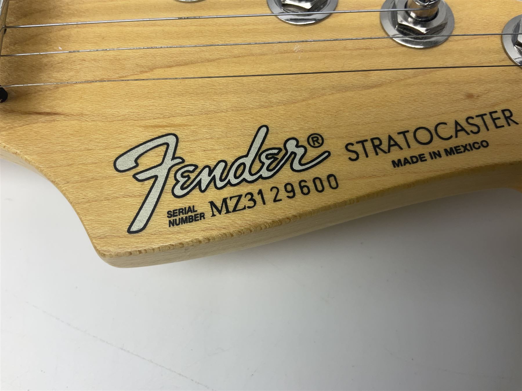 Mexican Fender Stratocaster electric guitar in black c2003 with Floyd Rose tremolo system, serial no.MZ3129600; L98cm; in Freestyle fitted case with 2006 Diamond Anniversary booklet