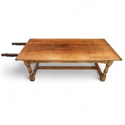 Late 20th century oak refectory table in 17th century style, with plank top and end leaf, raised on ring turned baluster legs with square feet, joined by conforming stretchers (260 cm extended)