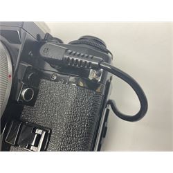 Canon A-1 camera body, serial no. 341014, with 'Canon FD 50mm 1:1.4 S.S.C.' lens, serial no. 12077119 and motor drive MA