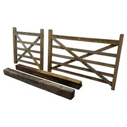 Two wooden gates with post hinges and latches