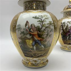 Pair of late 19th century Helena Wolfsohn vases and covers, each of baluster form with domed cover, painted with alternating panels of romantic scenes and floral sprays upon gilt ground, with Augustus Rex mark to base, H27cm
