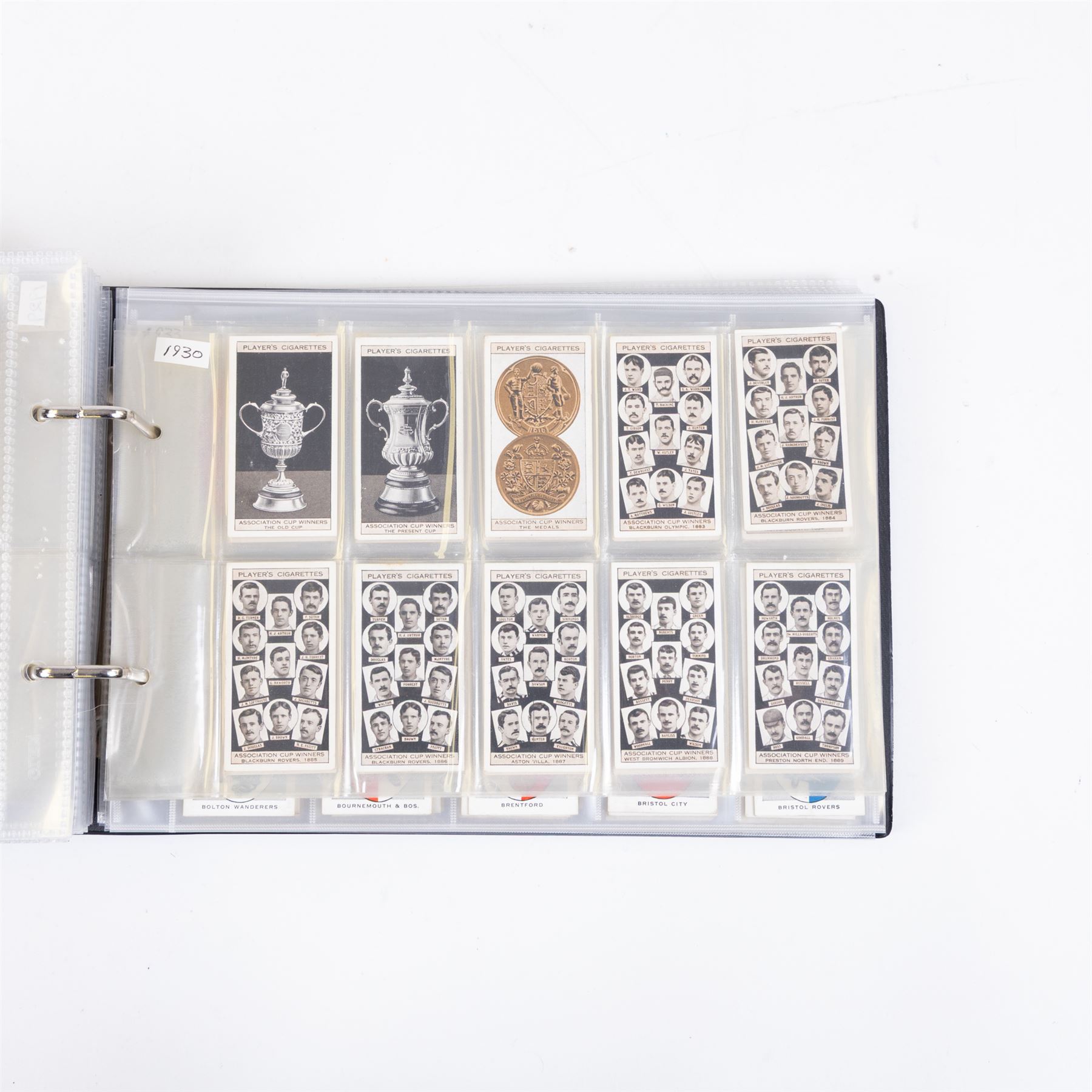 Collection of Edwardian and later Football related trading and cigarette cards, including forty-nine of fifty 1906 Ogden's Football Club Colours, 1922 PALS Footall series, ninety of one hundred 1925 Gallaher Famous Footballers, complete set of forty-four 1926 Ogden's Captains of Association Football Clubs and Colours, complete set of fifty 1927 Players Football Caricatures by MAC,  complete set of fifty 1927 Players Football Caricatures by RIP,  complete set of fifty 1930 Players Association Cup Winners, complete set of 50 1933 Ogdens AFC Nicknames etc, housed in brown cigarette card album