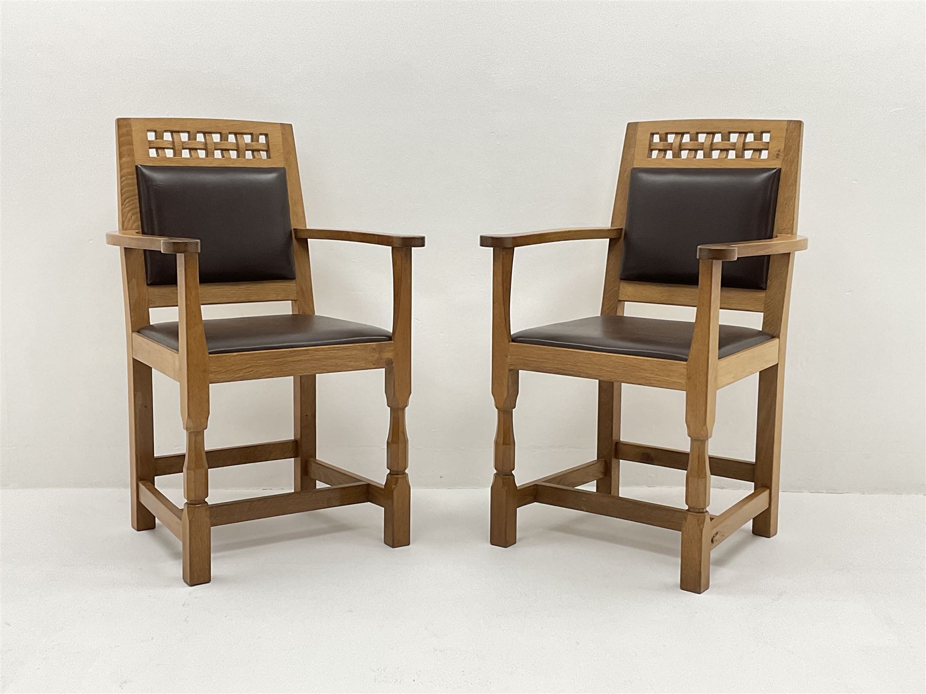 'Lizardman' set six dining chairs, two carvers and four side chairs, carved and pierced lattice top rail over cushioned back and drop in seat upholstered in brown leather, by Derek Slater of Crayke