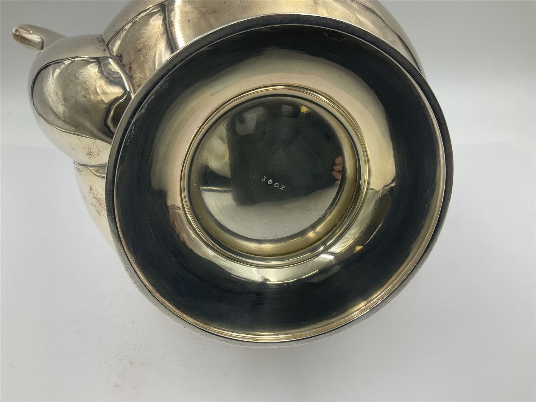 1920s five-piece silver tea service, comprising teapot, coffee pot, hot water pot, twin handled open sucrier and milk jug, each of squat circular form with shaped rim, the teapot, coffee pot and hot water pot each with ebonised handle and finial, the sucrier and milk jug with acanthus capped scroll handles, all upon circular foot, hallmarked R F Mosley & Co, Sheffield 1926 & 1927, tallest H24cm