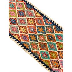 Anatolian Turkish Kilim ivory ground runner rug, decorated with all over multi-colour geometric lozenges with ivory outline
