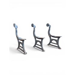Set of three mid-20th century cast iron towns and park bench ends, scrolling pediment over...