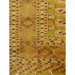  Bokhara green ground rug, repeating border, 184cm x 130cm  