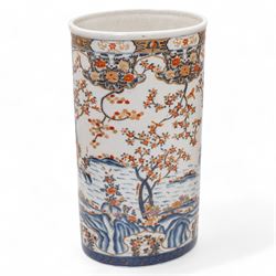 Late 19th/early 20th century Japanese imari charger, decorated with panels of mountains and bamboo, D46cm, and a large imari pattern stick stand, H48cm (2)