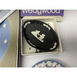 Wedgwood blue Jasperware, including commemorative plates of American independence, together with a black Jasperware trinket dish 