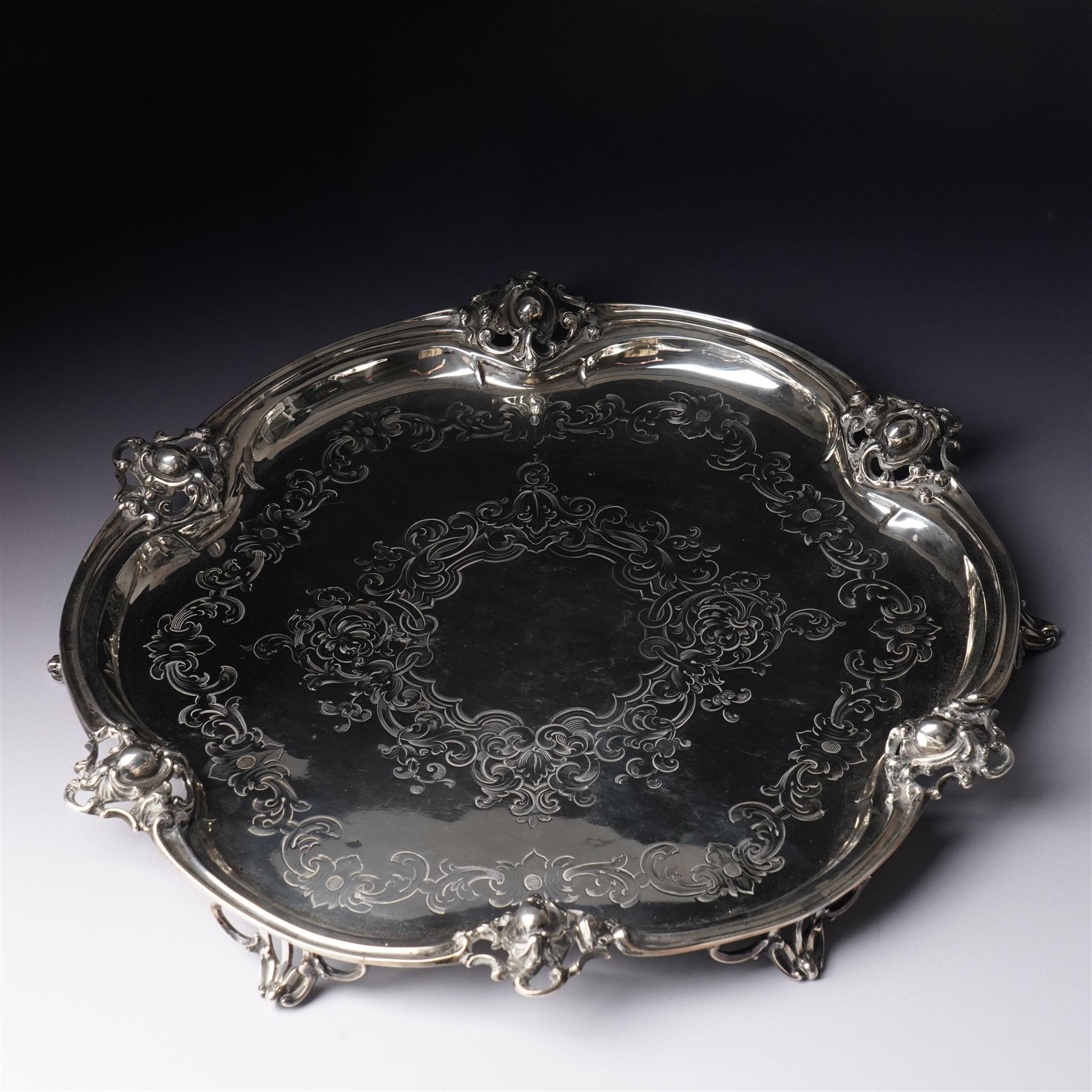 Victorian Scottish silver salver of shaped circular form with moulded border, engraved decoration and on pierced bracket feet D36cm Edinburgh 1854 Maker George Crichton 