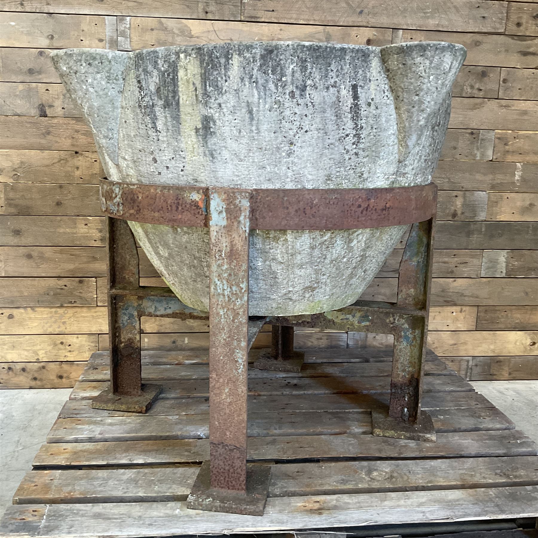 Large 19th century circular stone mortar planter on wrought iron stand