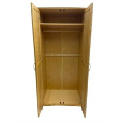 Contemporary beech double wardrobe, two panelled doors enclosing hanging rail