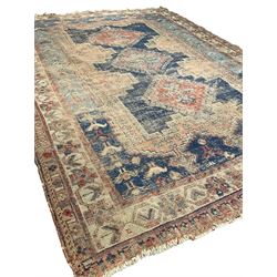 Antique Caucasian rug, indigo ground field decorated with three lozenge medallions within borders of stylised bird and flower head motifs