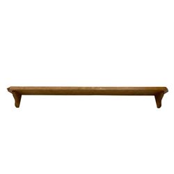 'Mouseman' oak wall shelf, canted rectangular top on shaped bracket supports, carved with mouse signature with trailing tail, by Robert Thompson of Kilburn