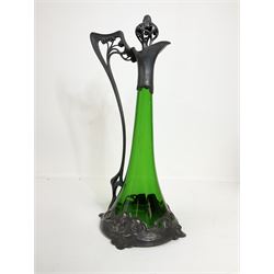 Early 20th century WMF Art Nouveau pewter and green glass ewer, of swept cylindrical form, having a pierced stopper and handle of entwined stems and berry design, the base cast as water nymphs with flowing hair and lily pads, H38cm