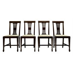 Set twelve (4+8) Edwardian inlaid mahogany dining chairs, cresting rail with satinwood banding, pierced splat backs with central inlay, drop-in seats upholstered in foliate patterned ivory fabric, raised on square tapering supports terminating in spade feet