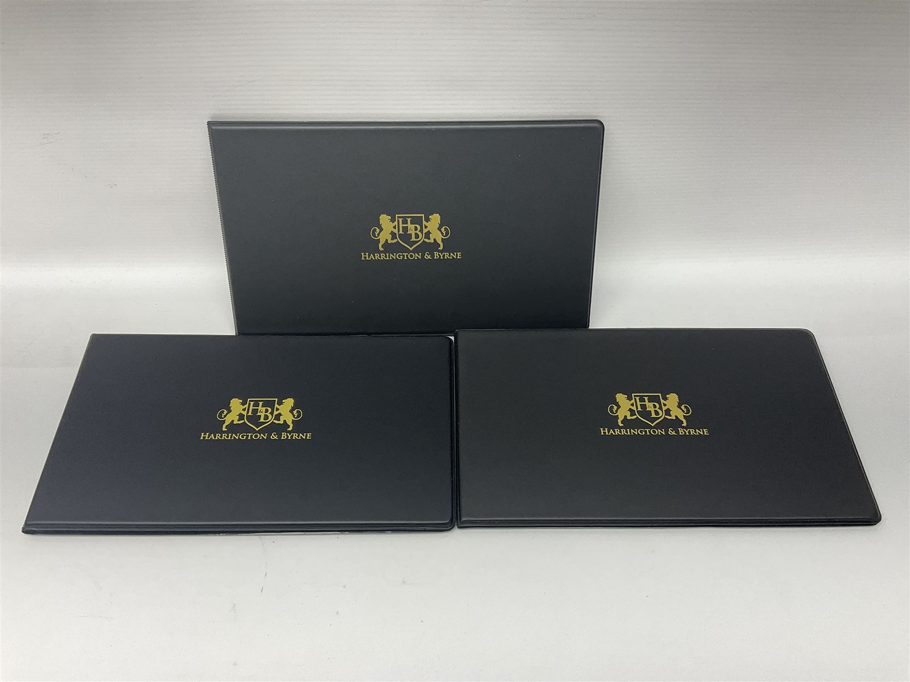 Three Queen Elizabeth II Tristan da Cunha silver proof coin covers, comprising 2021 'Royal Wedding Anniversary', 2022 'Queen Elizabeth II's Memorial Laurel' and 2022 'His Royal Highness Prince William The Duke of Cambridge', all in Harrington and Byrne folders