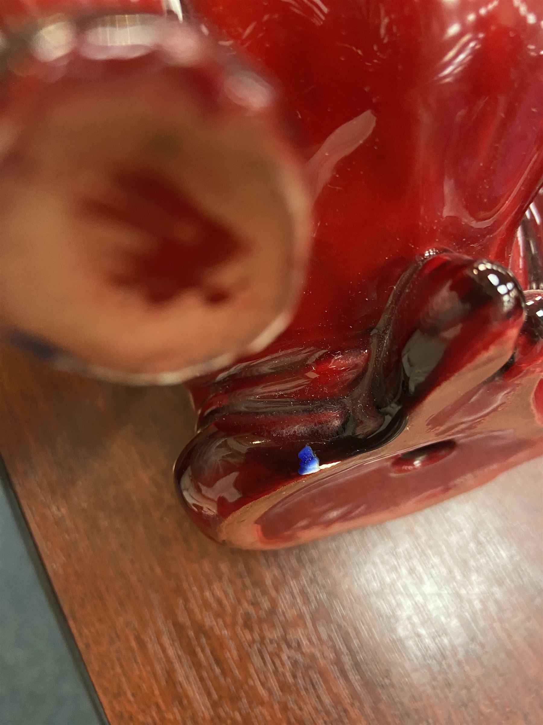 Royal Doulton Flambe figure of a Bulldog, modelled seated, model no 135, with printed maker's mark and K and impressed 135 beneath, H13.5cm