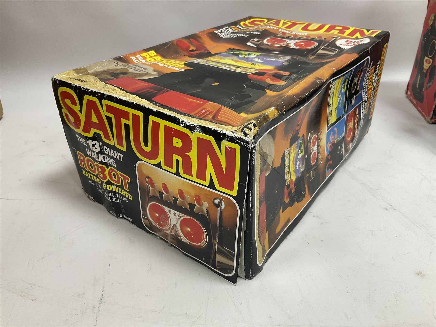 Three vintage battery operated robots comprising tin-plate Space Walk Man ME 100 Robot, Saturn the 13