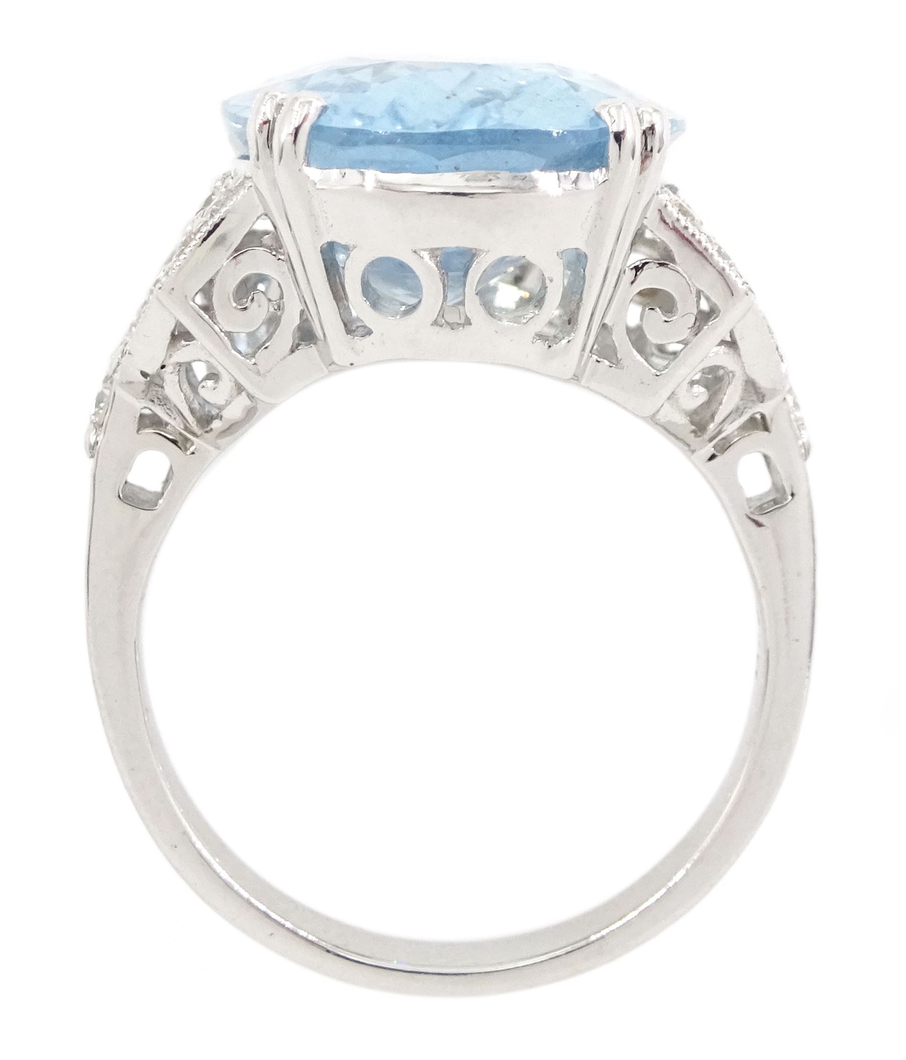 18ct white gold oval cut aquamarine ring, with milgrain set diamond, pierced design shoulders, stamp[ed 750, aquamarine approx 9.65 carat, total diamond weight approx 0.45 carat