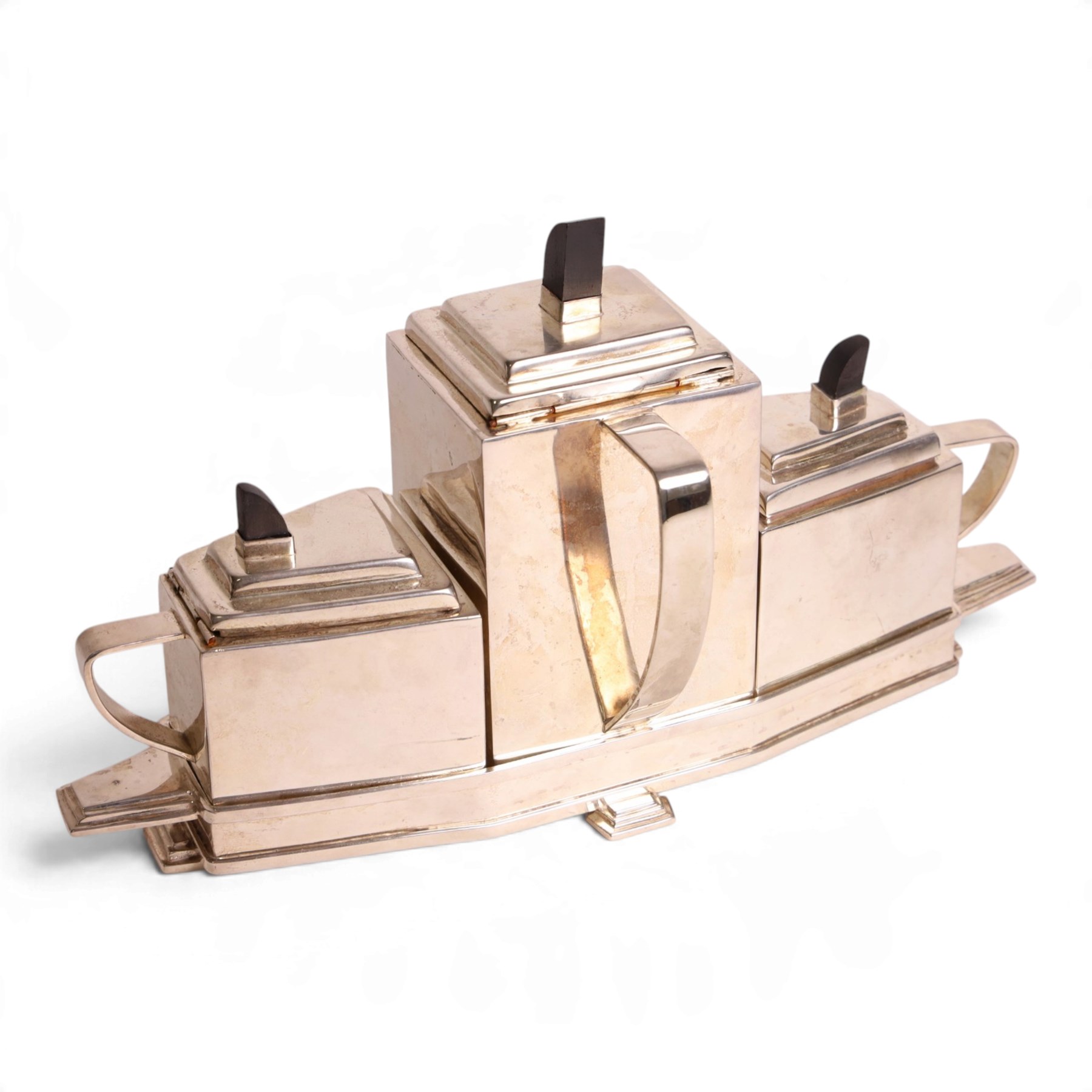 Art Deco silver plated tea set, in the manner of Christopher Dresser, within a fitted tray H23cm