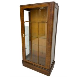 Early 20th century walnut display cabinet, single astragal glazed door enclosing three glass shelves, skirted base