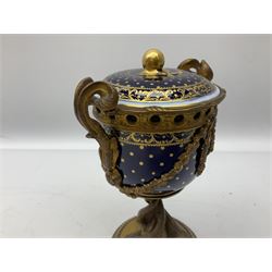 French Sevres ormolu mounted vase and cover, the bowl detailed in gilt with dots and scrolls upon a gros bleu ground, with ormolu mounted twin handles and swags, upon a stem modelled as three entwined dolphins and a circular base with beaded edge, overall H20.5cm