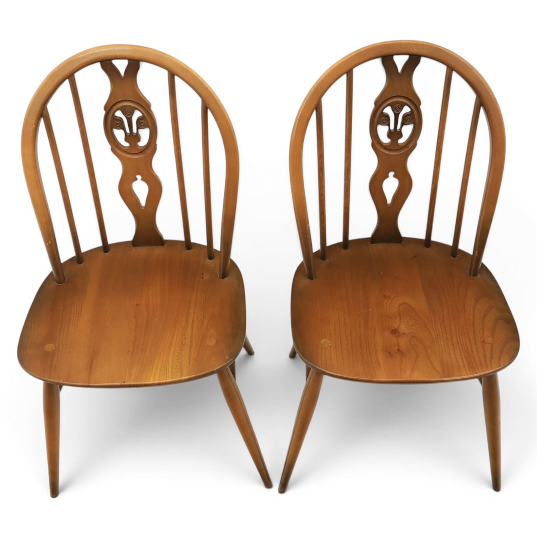 Ercol - Set of four dark elm 'Fleur De Lys' chairs