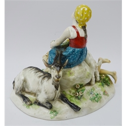  Meissen model of a Goatherd and his lass on a rocky outcrop, blue cross swords mark to base no. V124, L22cm   