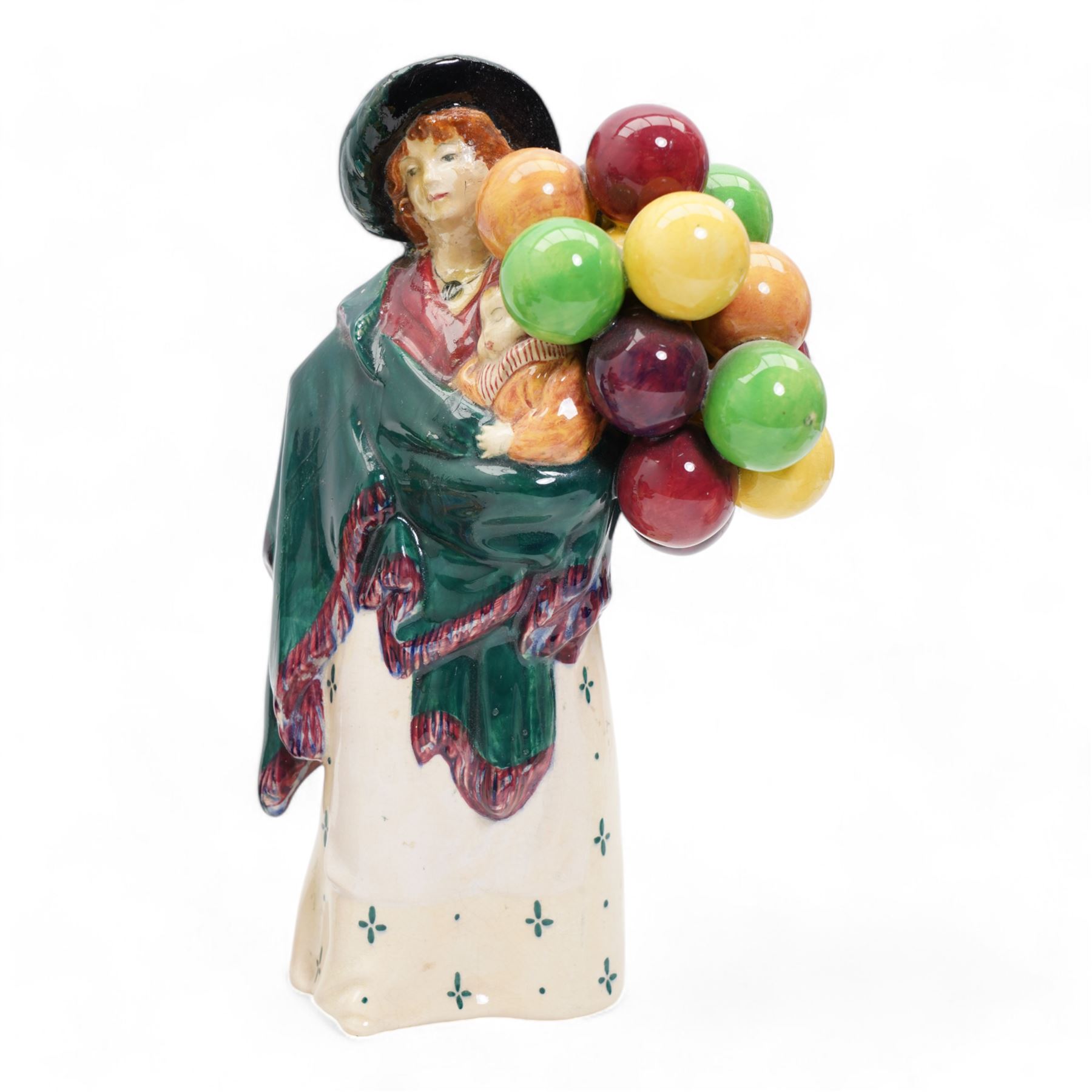 Four Royal Doulton figures comprising 'Sweet Lavender' HN1373, 'The Balloon Seller' HN583, 'Biddy Pennyfarthing' HN1843 and 'Silks and Ribbons' HN2017 (4)