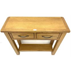 Light oak sidetable, two drawers, stile supports joined by solid under tier 