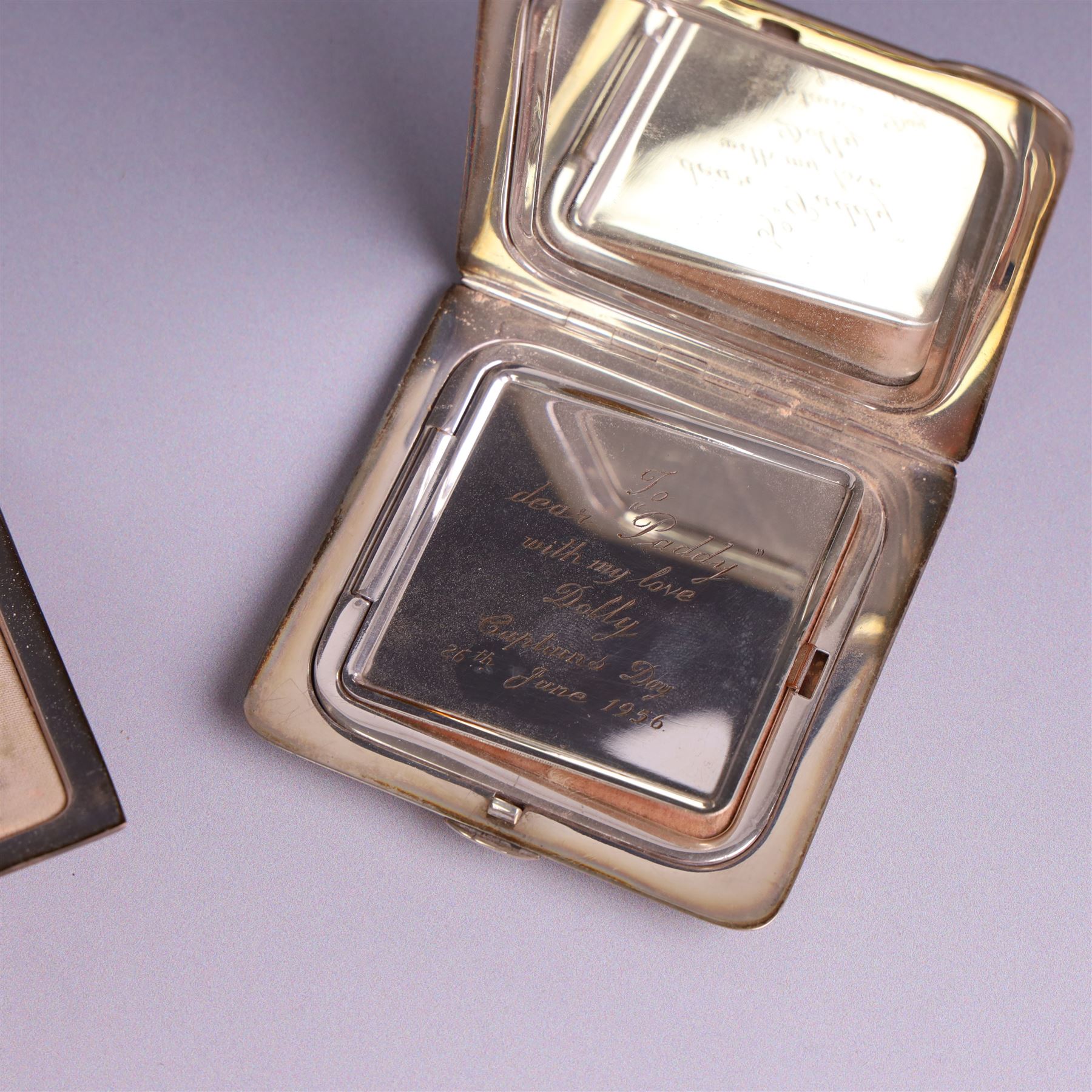 Two mid 20th century silver compacts, both rectangular with engine turned decoration, one with engraved monogram to cover, hallmarked Randle Brothers, Birmingham 1946, the other with personal engraving to interior, hallmarked William Suckling Ltd, Birmingham 1947, H7cm, both in fabric pouches