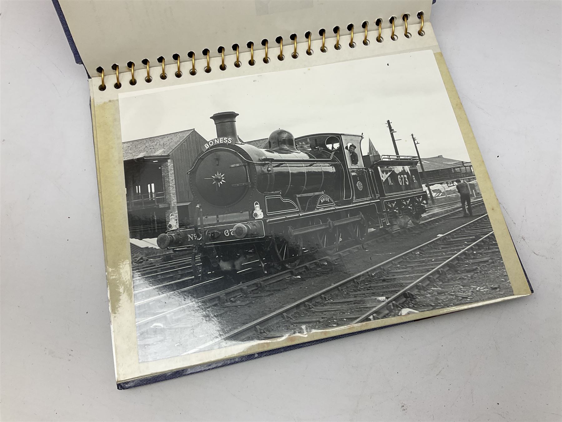 Black painted three colour railway lamp with revolving filters, H29cm; BR Acme Thunderer whistle; three railway peaked caps, two with BR Intercity 125 badge; small album of photographs of railway interest etc