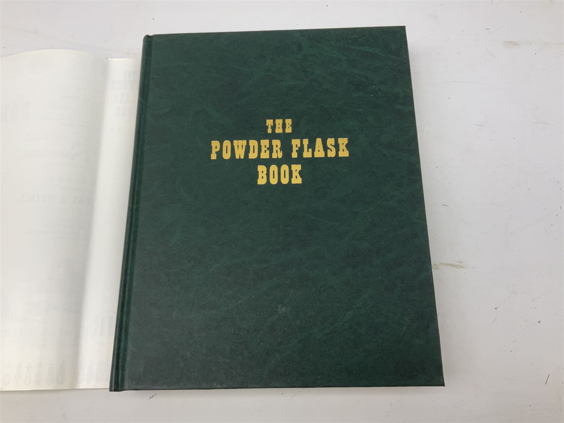 Riling Ray: The Powder Flask Book. 1992 R&R Books facsimile edition of the 1953 original; four powder measures including two by G. & J.W. Hawksley with horn handles; 16-bore combined spent cartridge and broken case remover; and turnscrew screw-driver (7)