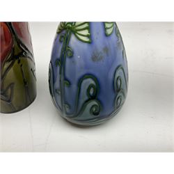 Minton Secessionist vase, with tube-lined stylised flower head decoration on a blue ground, printed mark to base 'Minton Ltd, No. 30', together with another Minton Secessionist tubelined vase,  printed mark to base 'Minton Ltd, No. 16', tallest example H13.5cm