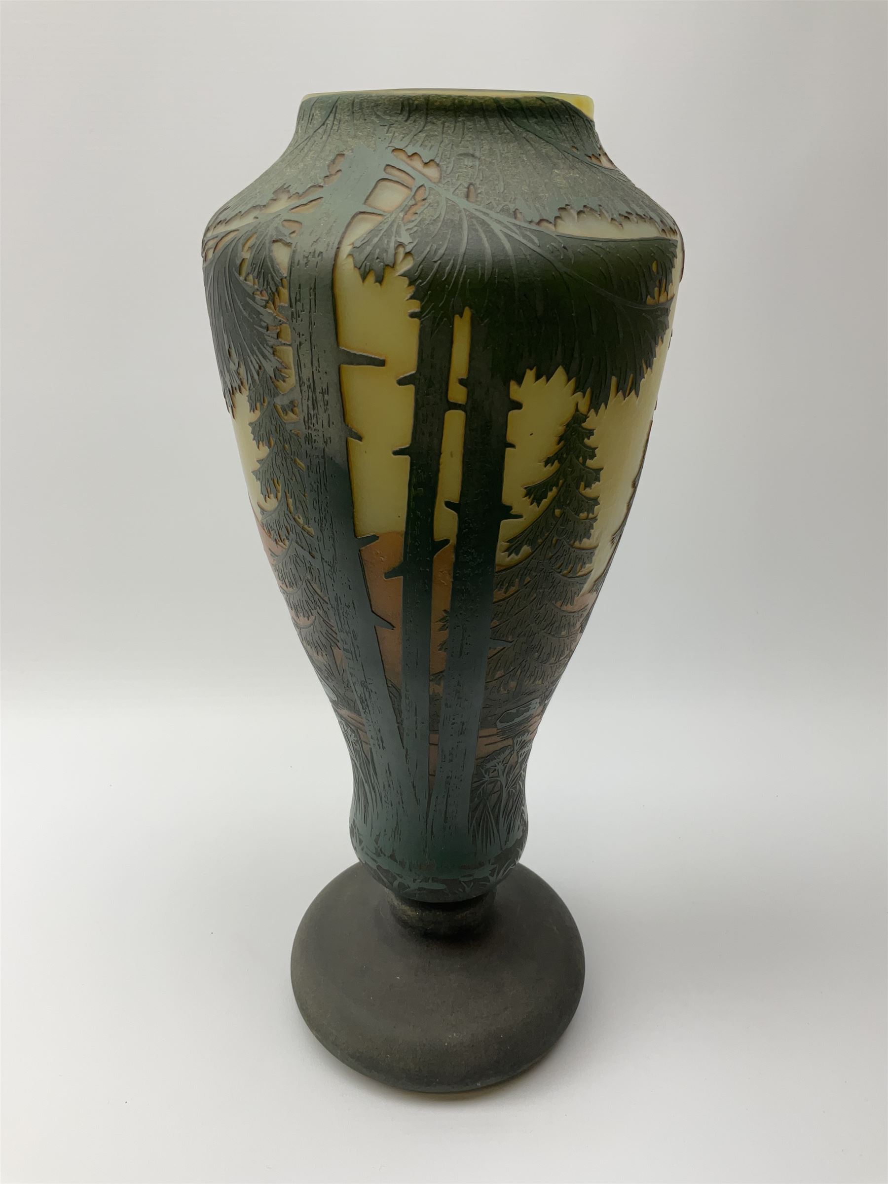 Reproduction Daum Nancy art nouveau  style overlay and cut glass vase in ovoid form with a circular base, decorated with woodland and mountain scene, H38.5cm. 