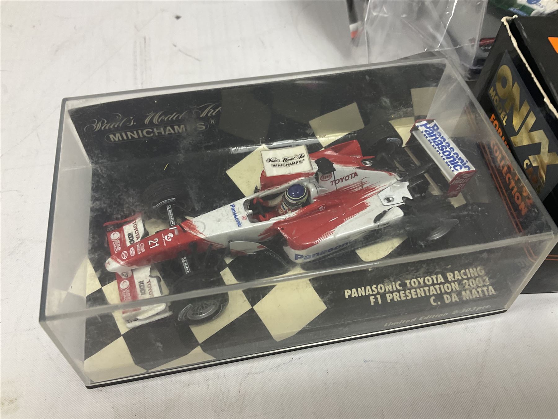 Panini Formula 1 The Car Collection - twelve die-cast models including ten in unopened packaging with periodical; all models in plastic display boxes; and eight other boxed die-cast models of racing cars by Corgi, Onyx, Classico, Minichamps etc (20)